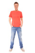 © Voyagerix - Young man guy red t-shirt jaens with hands in pockets isolated