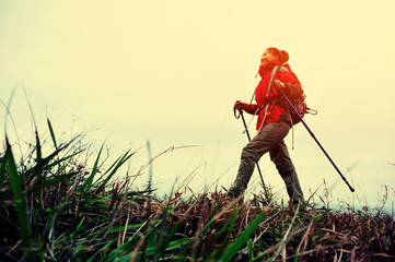 woman hiker hiking on seaside trail 