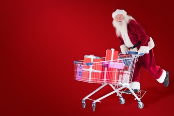 Poster - Composite image of santa rides on a shopping cart