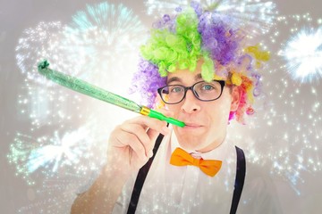 Aufkleber - Geeky hipster wearing a rainbow wig blowing party horn