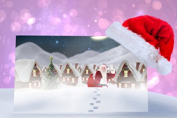 Aufkleber - Composite image of santa delivery presents to village