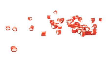 Multiple red candy sweets spilled over the surface