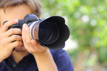 Close Up Of A Photographer Using A Dslr Camera