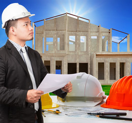 architect man and working ducument plan in house construction si