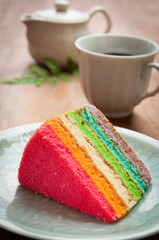 Wall Mural - Delicious rainbow cake on plate on table