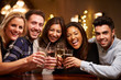 © Monkey Business - Group Of Friends Enjoying Evening Drinks In Bar