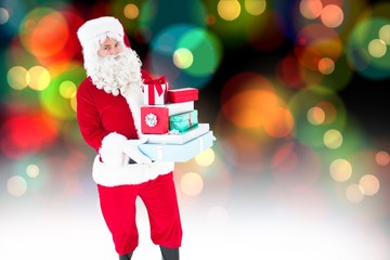 Poster - Composite image of father christmas holding many gifts