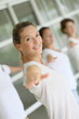 © goodluz - Attractive blond woman attending yoga course with group