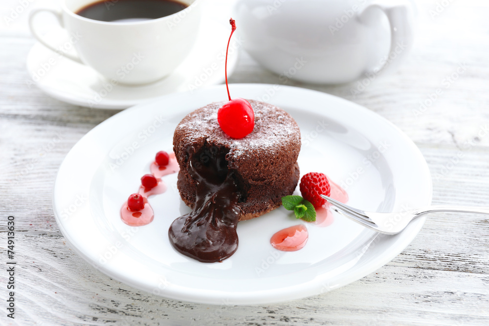 Hot chocolate pudding with fondant centre on plate, close-up