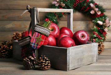 Christmas apples on wooden table