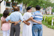 © DragonImages - Embracing senior friends
