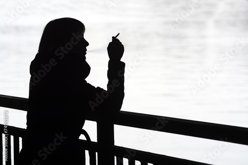 Junge Frau Raucht Am Fluss Silhouette Berlin Deutschland Buy This Stock Photo And Explore Similar Images At Adobe Stock Adobe Stock