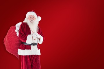 Poster - Composite image of santa carries his red bag