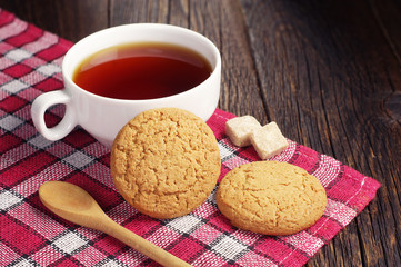 Tea cup with oatmeal cookie