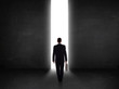 © ra2 studio - Business person looking at wall with light tunnel opening