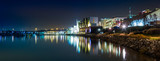 Fototapeta Nowy Jork - The Potomac River waterfront at night, in National Harbor, Maryl