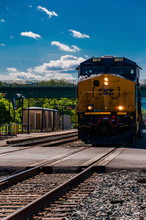 A CSX Train Approaching A Road Crossing In Brunswick, Maryland.