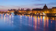 Seine river and Old Town of Paris (France) at night