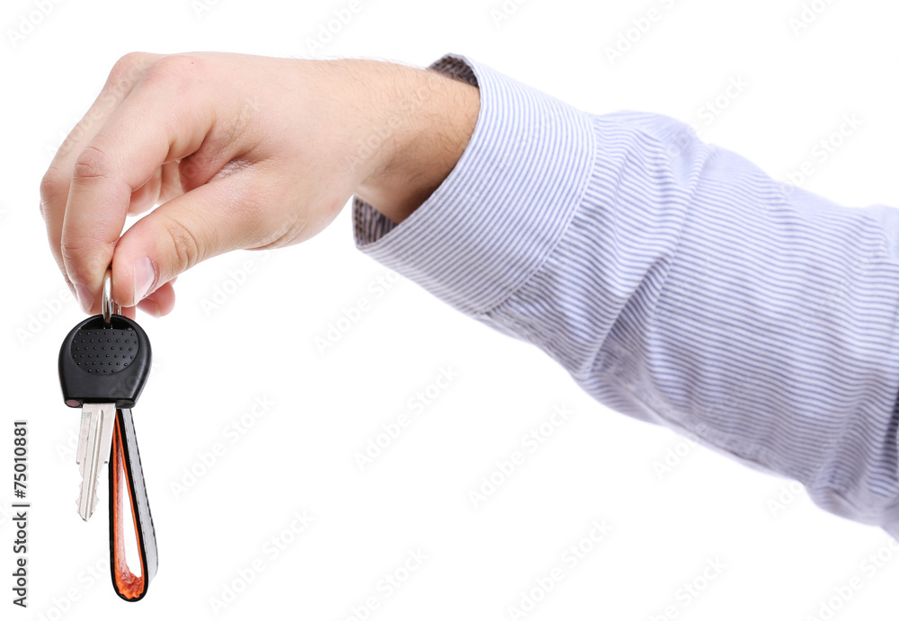 Businessman holding car key isolated on white