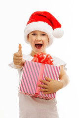 Child holding Christmas gift box in hand. Isolated on background