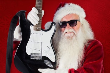 Poster - Composite image of father christmas shows a guitar