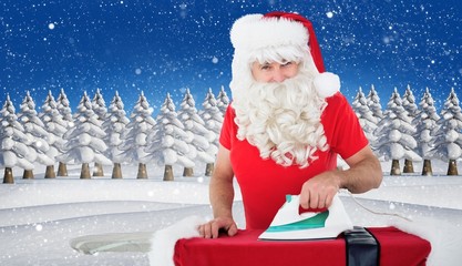 Aufkleber - Composite image of happy santa claus ironing his jacket