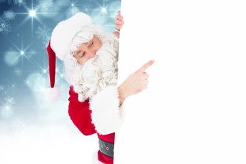 Poster - Composite image of festive father christmas presenting sign
