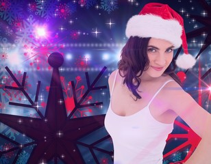 Poster - Composite image of portrait of a pretty brunette in santa hat