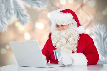 Poster - Composite image of santa using laptop