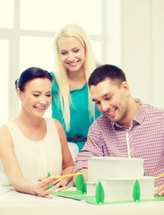 Canvas Print - smiling architects working in office