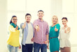 © Syda Productions - happy creative team showing thumbs up in office