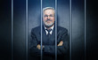 © dbunn - Geschäftsmann hinter gittern