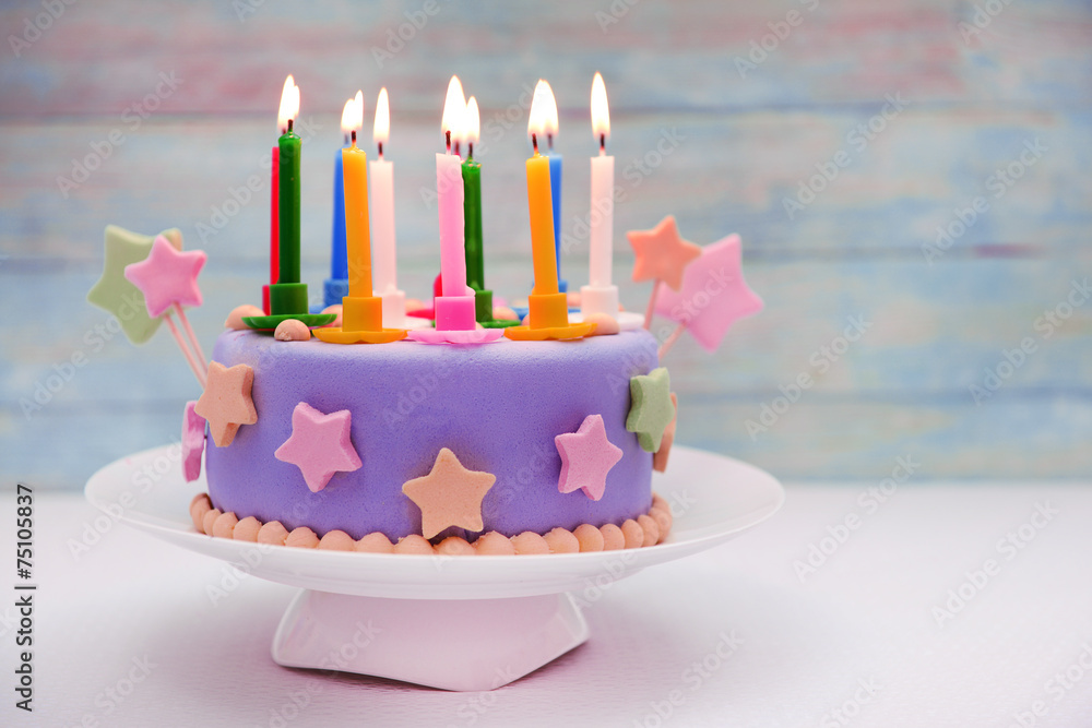 Delicious birthday cake on table on light background