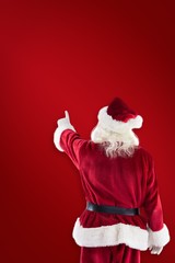 Aufkleber - Composite image of santa claus points at something
