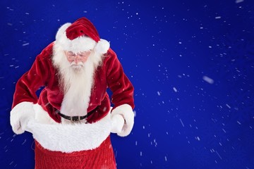 Aufkleber - Composite image of santa looks in his bag
