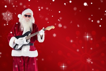 Aufkleber - Composite image of santa claus plays guitar with sunglasses
