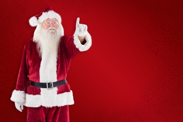 Poster - Composite image of santa claus points at something