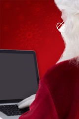 Aufkleber - Composite image of santa claus uses a laptop
