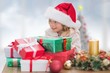 © WavebreakmediaMicro - Composite image of cute little girl with gifts