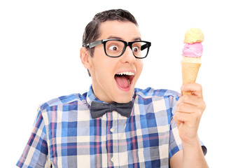 Wall Mural - Excited young man looking at ice cream