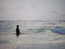 Fisherman On The Beach Of Kuta In Bali