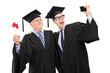 © Ljupco Smokovski - Senior and guy in graduation gowns taking a selfie