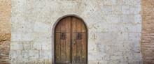 Old Wooden Door And Stone Wall