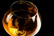 snifter of brandy in elegant glass with space for text