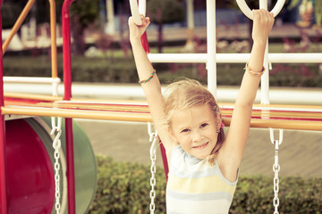 Wall Mural - Happy little girl on the playground