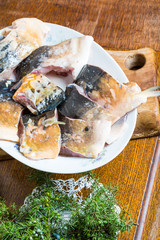 pieces of carp fish in marinade ready for frying