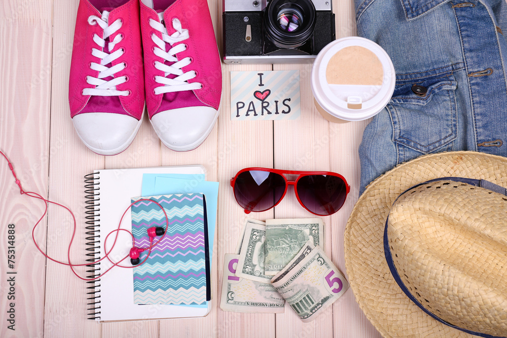 Travel things for traveling on wooden background top view