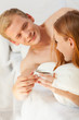 © Photographee.eu - Woman and mad sharing coffee in bed