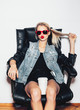 © Kaponia Aliaksei - Fashoin hipster girl in sunglasses  drink hot coffee