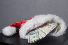 Money In A Christmas Cap Santaklaus